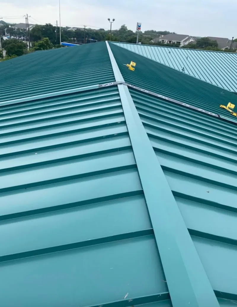 Green commercial metal roof ridge and valley for Metal Roof Repair in Fort Shawnee
