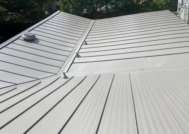 Solar attic fan installed on a metal roof for Roof Ventilation in Fort Shawnee